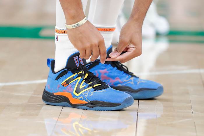 View of blue and black New Balance shoes.